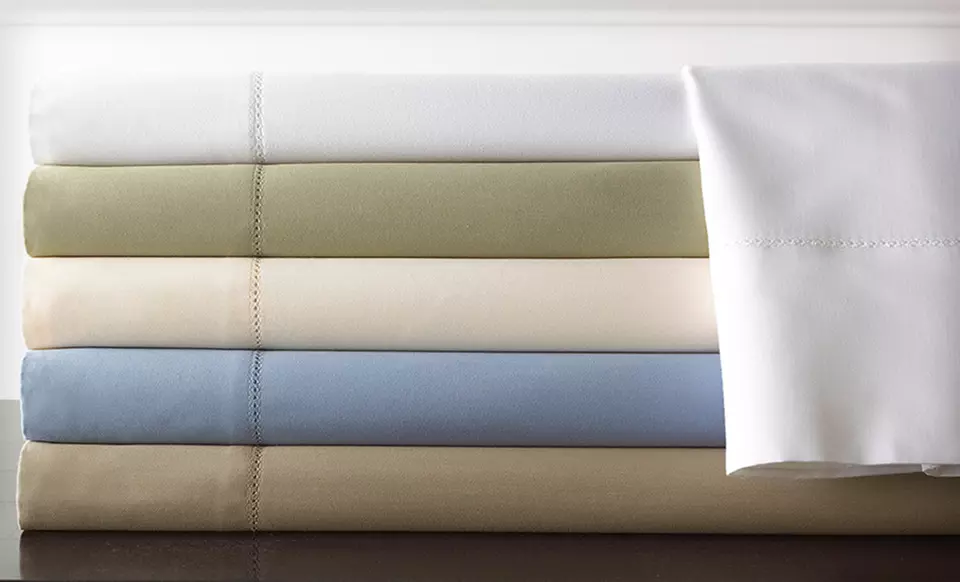 Wrinkle-Free Symphony 1,000-TC Egyptian-Cotton Rich Sheet Set ($199.99 List Price). 15 Options Available. Free Shipping and Returns. - Primary Image