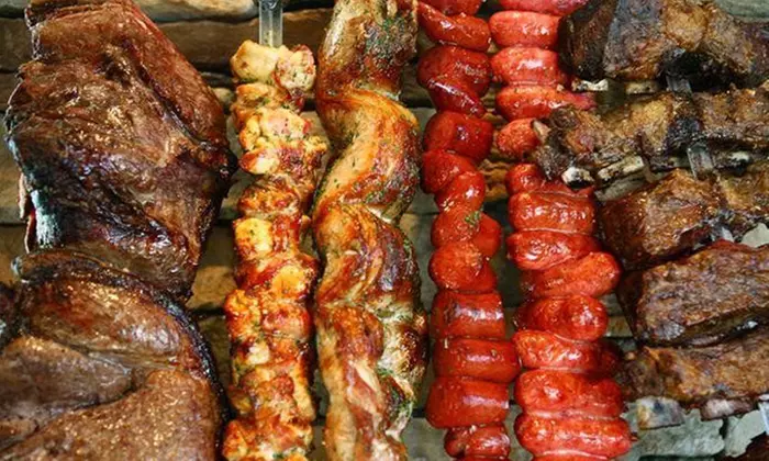 Brazilian Barbecue Dinner for Two or Four Adults at Midwest Grill (47% Off - Primary Image