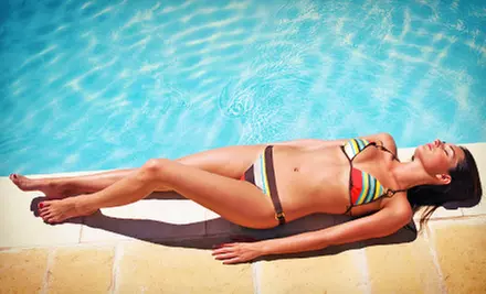 One Month of Unlimited Tanning in a Basic or Medium-Pressure Bed or One Spray Tan at Tan Rio (Up to 57% Off) - Primary Image