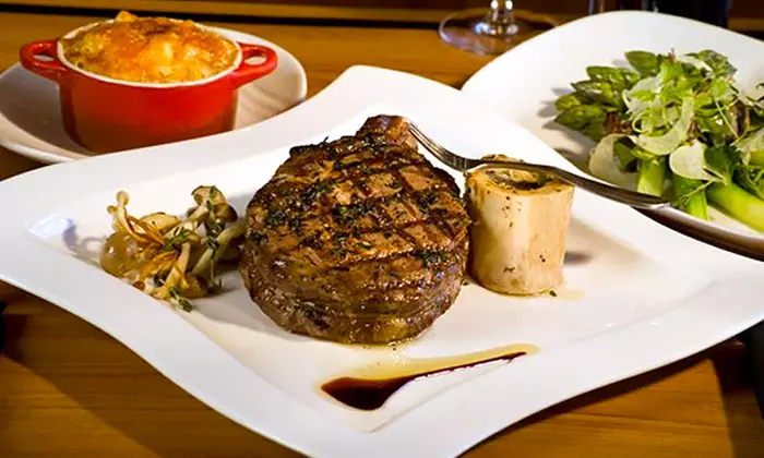 Steakhouse Dinner with a View for Two Plus Complimentary Champagne Toast at VooDoo Steak and Rooftop Lounge  - Primary Image