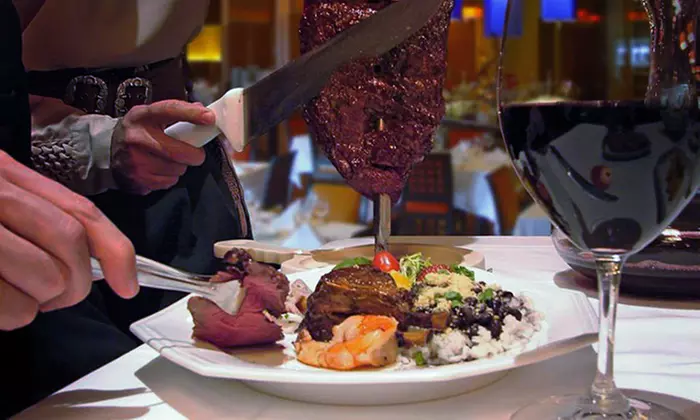 Rodizio Dinner for Two or Four with Wine and Dessert at Taurinus Brazilian Steakhouse (Up to 24% Off) - Primary Image
