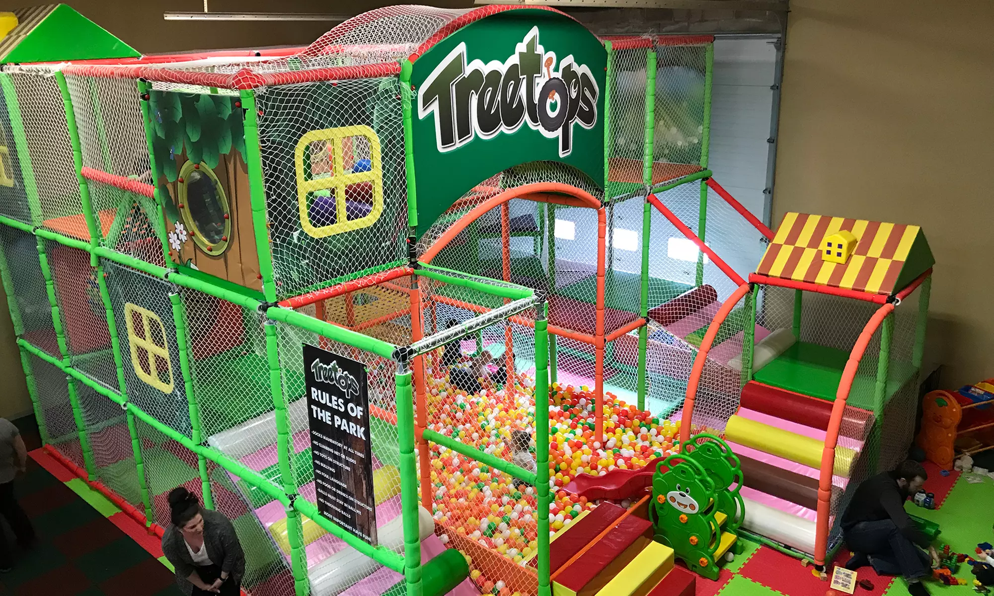 Two or Four Passes for One or Child's Haircut with an Optional Play Pass at Treetops Playground (Up to 48% Off) - Primary Image