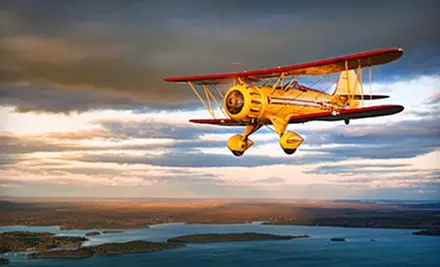 $85 for a Biplane Flight Over Downtown Atlanta or Stone Mountain Park Plus Free Appetizer or Dessert at the 57th Fighter Group Restaurant (Up to $178 Value) - Primary Image