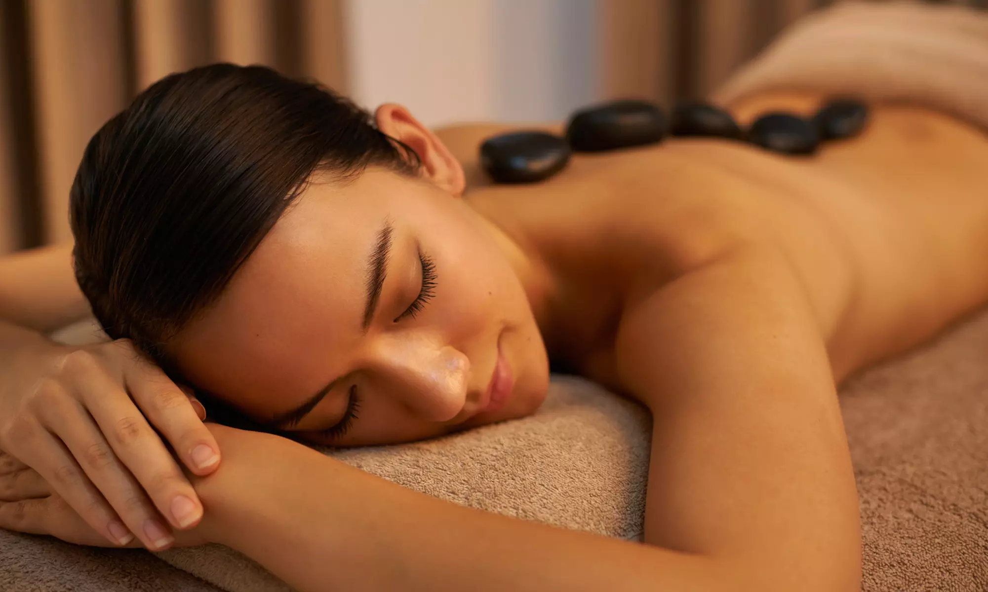 One or Two 60 Minute Swedish or Deep-Tissue Massage with Hot Stones at Lotus Massage Center (Up to 38% Off) - Primary Image