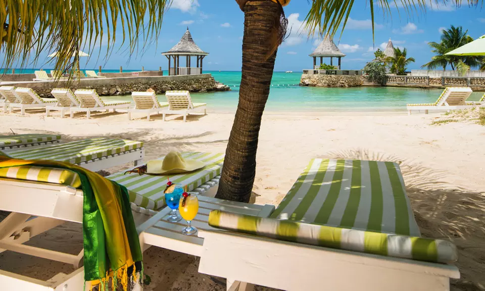 ✈ 4-Night SeaGarden Beach Resort Stay w/ Air, Tax & Hotel Fees; Price per Person Based on Double Occupancy - Primary Image