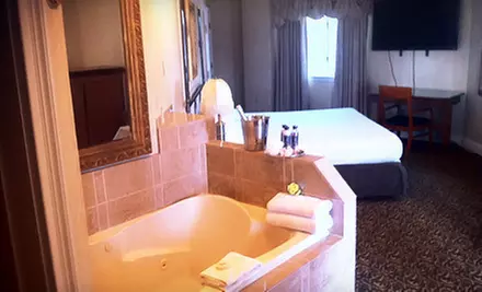 Stay with Romance and Bubbles Package at Cedar Park Inn & Whirlpool Suites (Up to 53% Off). Three Options Available. - Primary Image