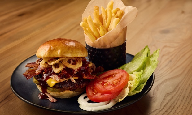 Campfire dinner with open-flame grilled dishes at Gather Round Fireside Great Wolf Lodge