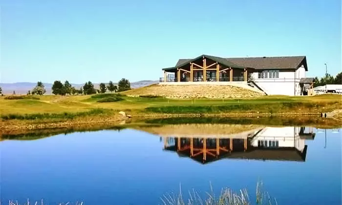 18 Holes of Golf for 2 or 4 with Cart Rental and Range Balls at The Bridges at Claresholm ( 56% Off)  - Primary Image