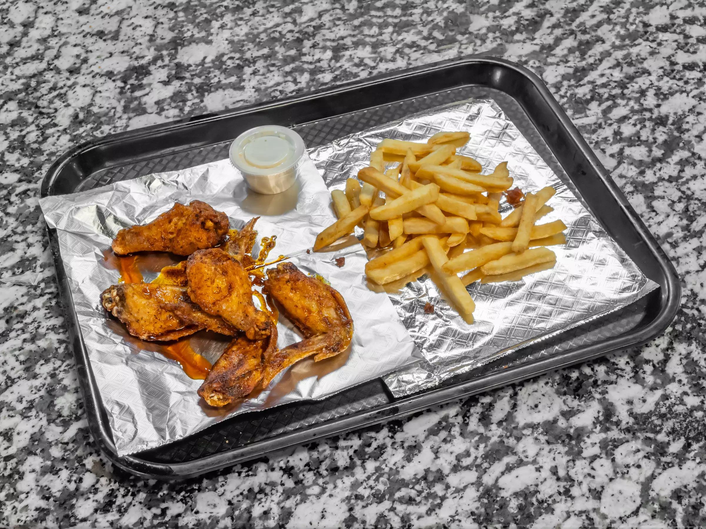 Fly High on Flavor: $15 or $30 to Spend on Wings and More at Wing Daddy. Save Up to 40% - Primary Image