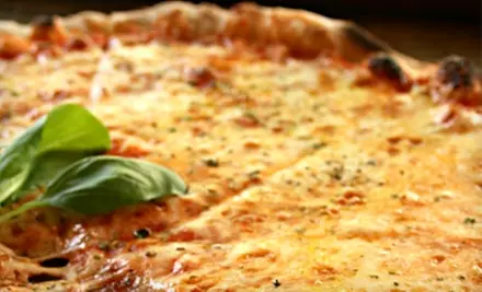 $15 for $30 Worth of Pizza, Burgers, and Drinks at Cinebarre - Primary Image