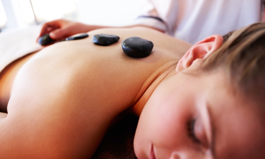 Image 1: Relax w/ Prenatal Massage or 60 Min: Body Massage w/ Hot Stones & More