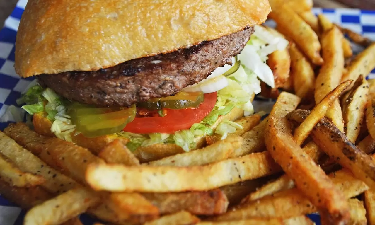 Burgers and Fries and/or Wing Baskets for Two or Burgers and Fries for Four at The Hangar (Up to 44% Off) - Primary Image