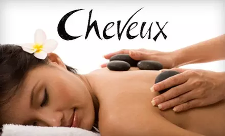 $49 for 75-Minute Hot Stone Massage and Herbal Towel Facial at Cheveux ($100 Value) - Primary Image
