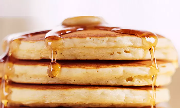 Two Egg & Cheese Sandwich Combos with Coffees or Two Stacks of Pancakes with Coffees at Fatburger (39% Off) - Primary Image