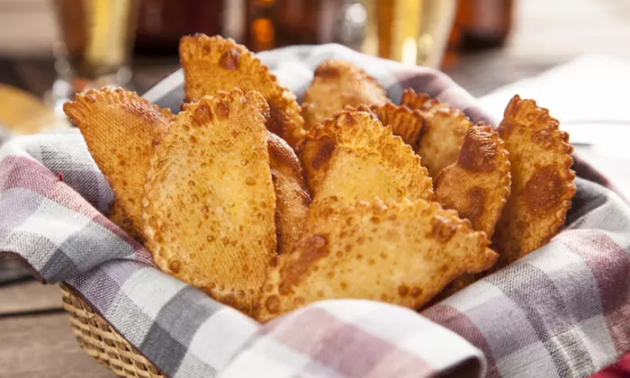 $18 for Dinner for Two of 12 Empanadas and 2 Juices at Empanadas Monumental ($42.20 Value)  - Primary Image