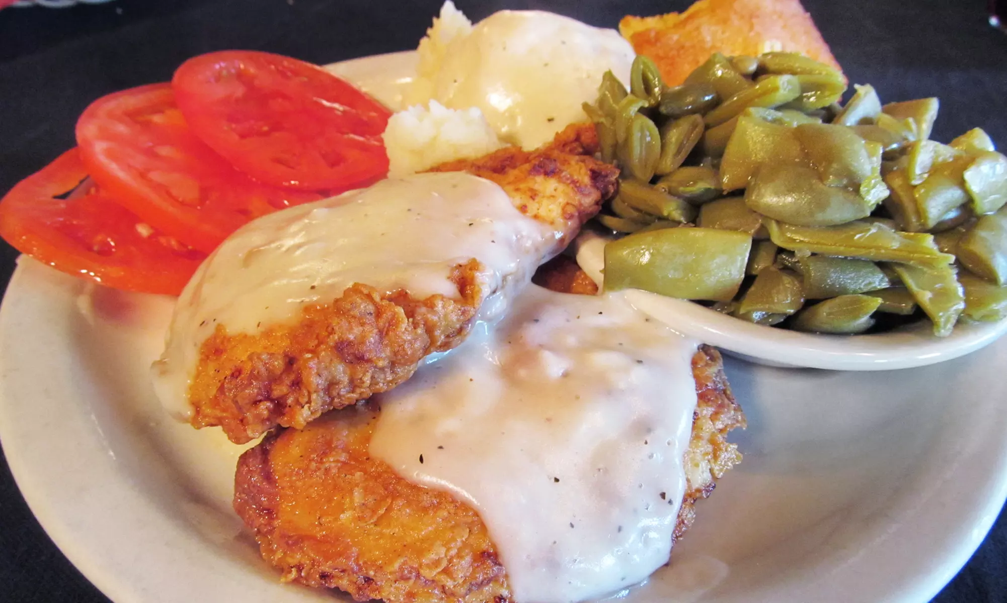 $16 Worth of Farm-to-Table Comfort Cuisine and Drinks for Two or More at The Moose Cafe (36% Off) - Primary Image