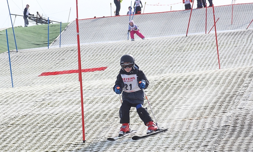 Image 1: Skiing or Snowboarding Lessons