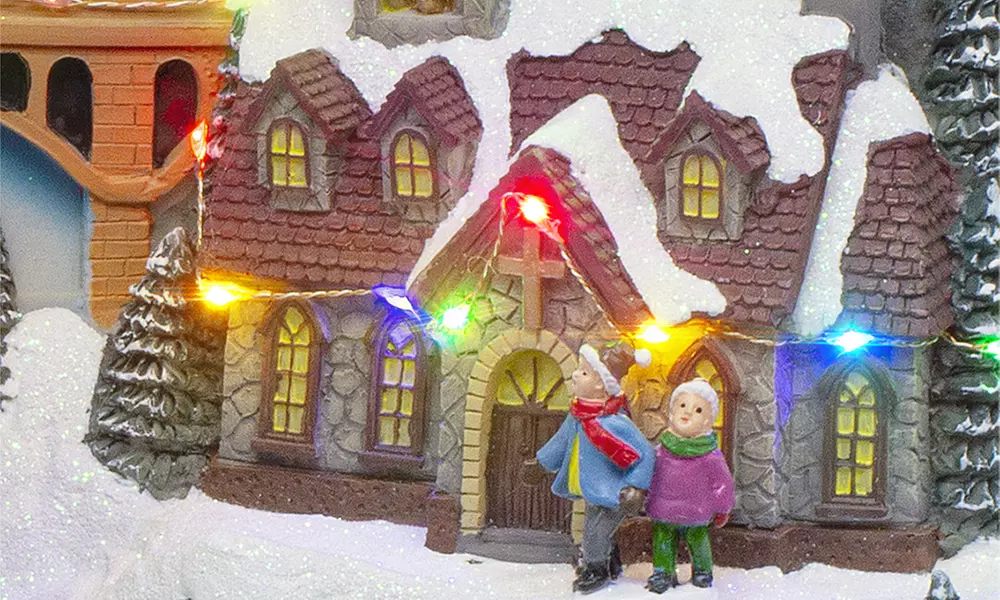 Adorno navideño "Aldea de Navidad" con luces de colores y melodía