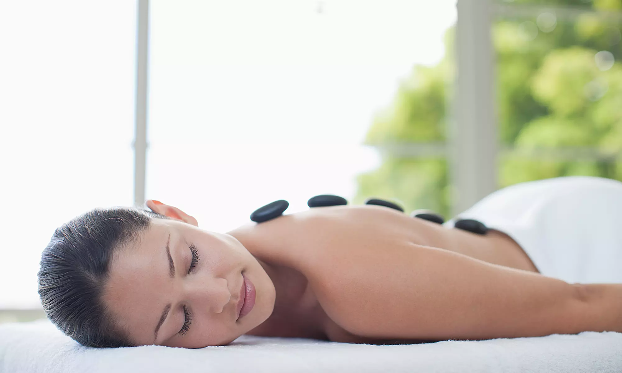 60- or 90-Minute Hot Stone Massage at Transcendence Massage and Facial Spa (Up to 58% Off) - Primary Image