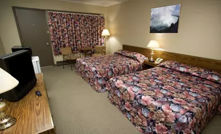 One- or Two-Night Stay with Dining Credit at Candlelight Inn (Up to 62% Off). Purchase Multiple Groupons to Extend Stay. - Primary Image