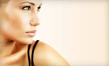 One Spray Tan, One Month of UV Tanning, or Three Months of Red-Light Therapy at J2 Tanning (Up to 60% Off) - Primary Image