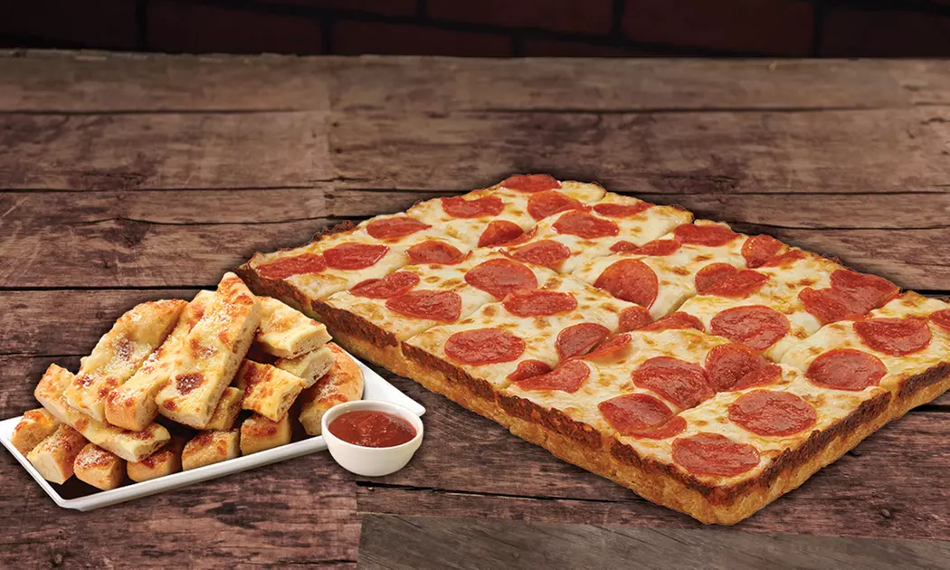 One or Two Large One-Topping Pizzas with Bread and Pop at Jet's Pizza (46% Off)  - Primary Image