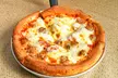 Dig into the legendary Deep-Dish Pizza: Grab $35 or $50 to spend at Connie’s Pizza (Save up to 30%) - Second Medium