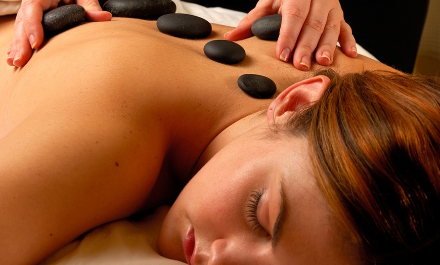 Image 1: Relax Deeply with a 30, 60, 90-Minute Hot Stone Massage