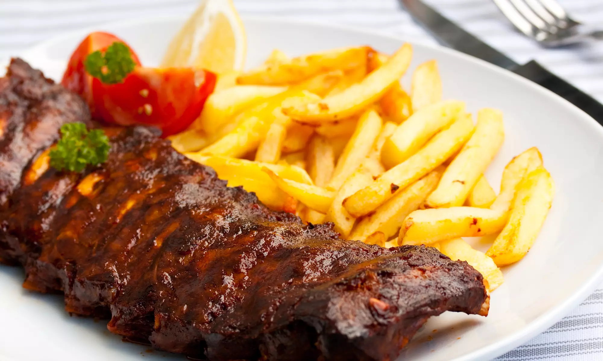 BBQ Meal for Two or BBQ Package for up to Twelve at Texas Pit Bar-B-Que (Up to 40% Off)  - Second Medium