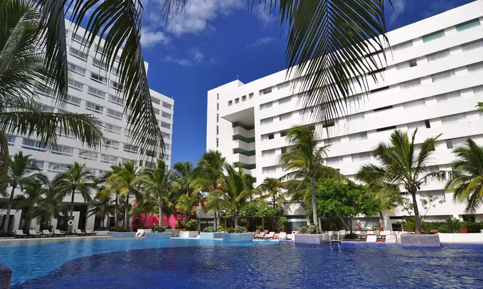 All-Inclusive Grand Oasis Palm Vacation with Airfare. Includes Taxes and Fees. Price/person Based on Double Occupancy. - Second Medium