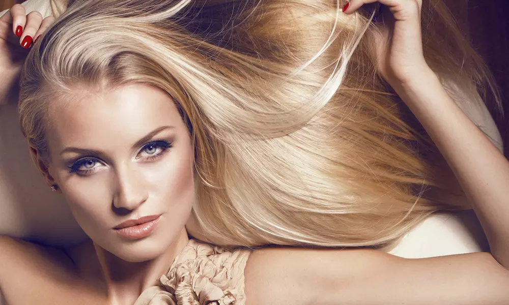 Get Sleek Hair with Blowout, Keratin Smoothing, Hair Treatment with Trim, or Flat Iron - Up to 35% Off