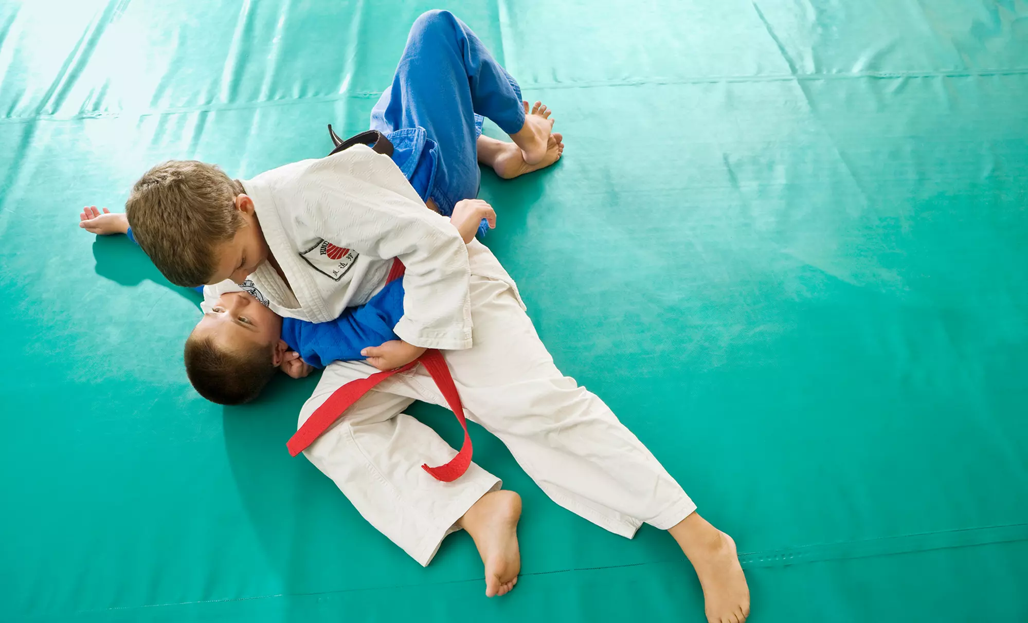 PTC Combat Fitness: Explore Unlimited Kickboxing & Kids Jiu-Jitsu Classes Up to 50% Off - Primary Image