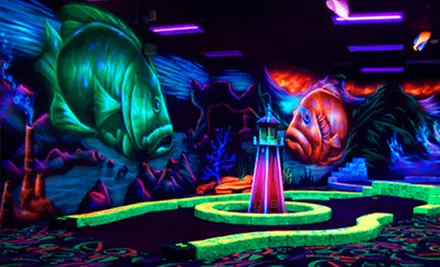 Black-Light Mini-Golf and Mini-Bowling for Four or Golf Simulator Play at Oceans 18 in New Bedford (Up to 52% Off) - Primary Image