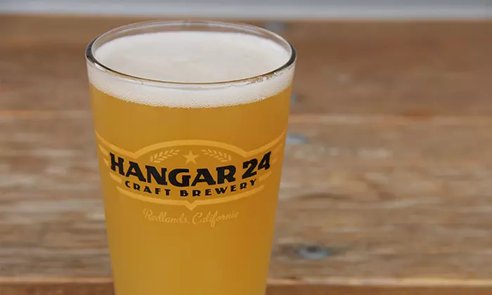 Beer Pints, Souvenir Glasses, and Take-Home Growlers for Two or Four at Hangar 24 Craft Brewery (Up to 42% Off) - Primary Image