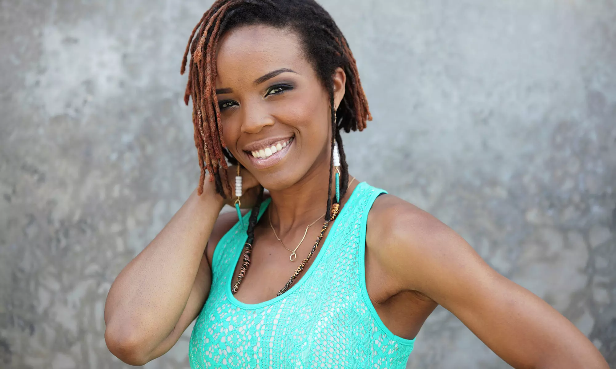 Dread Twist, Haircut, Highlight, Color, or Weave from Michelle Merritt (Up to 71% Off). Five Options Available. - Primary Image