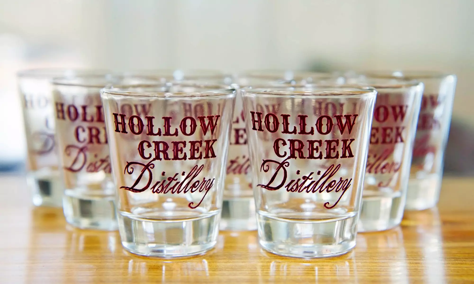 Experience Hollow Creek Distillery's Tour for Two or Four with Souvenir Shot Glasses & T-Shirts, Up to 43% Off - Primary Image