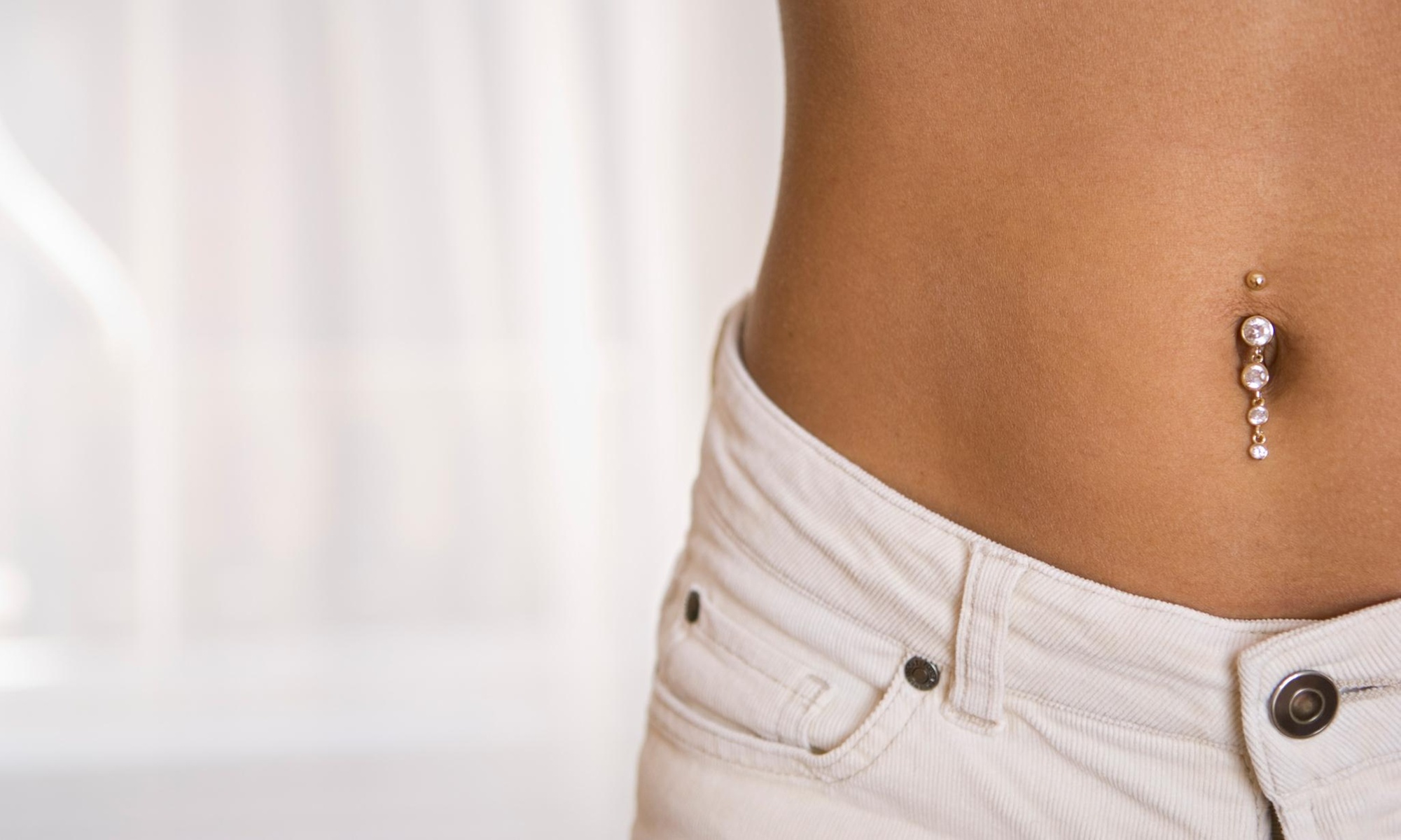 Professional Piercing Session with Basic Jewelry at 44% Off