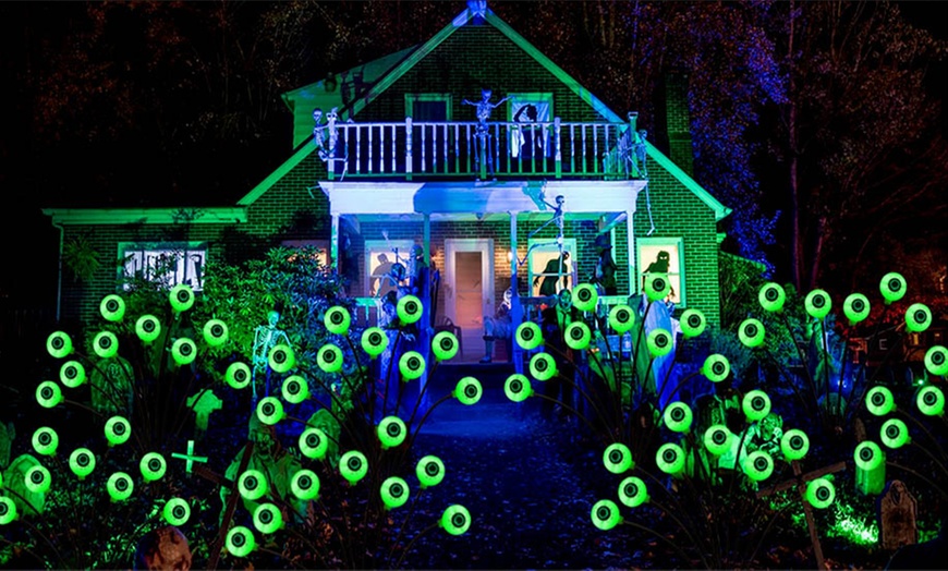 Image 3: Two or Four Packs of Solar Eyeball-Themed Outdoor Lights