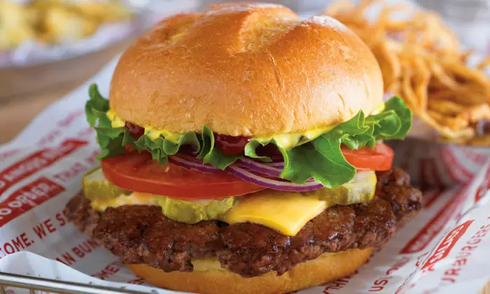 Angus Burgers and Chicken Sandwiches, Fries, and Salads at Smashburger (Up to 45% Off). Two Options Available.  - Primary Image