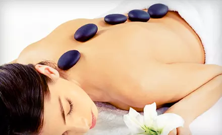60- or 90-Minute Massage with Choice of Hot-Stone, Swedish, or Deep-Tissue Style at Strands Salon & Spa (Up to 51% Off) - Primary Image