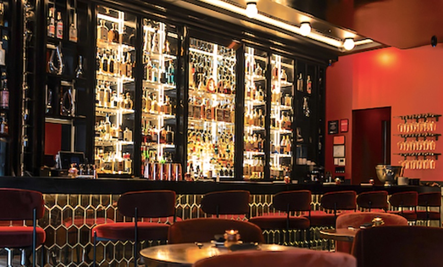 Image 7: Three-Course Dinners or Dining Credits at a NYC Wine Lounge