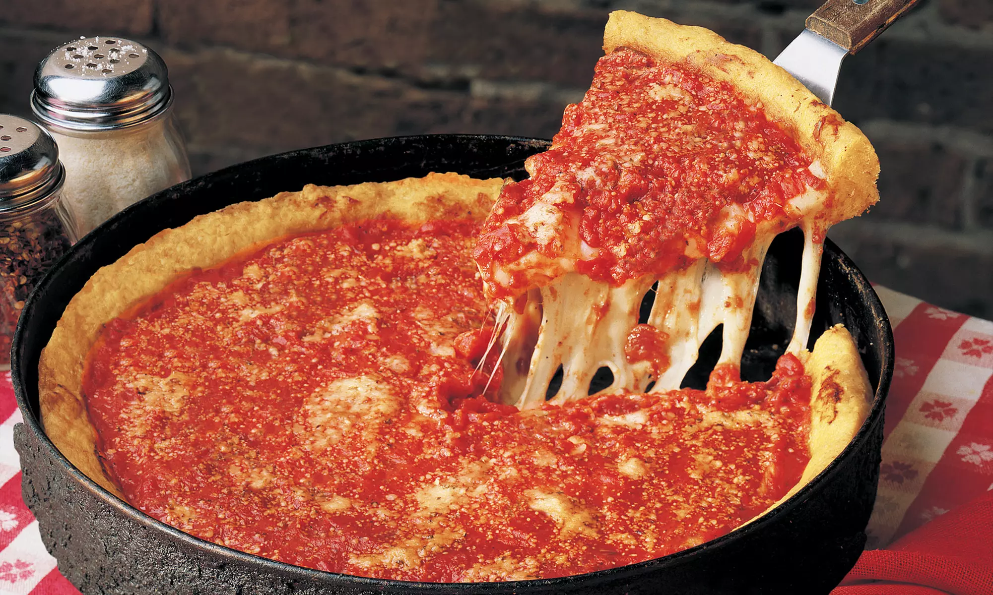 $16 for $30 Worth of Deep-Dish Pizza, Pasta, Sides, and More at Gino's East on Higgins  - Primary Image