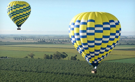 Balloons above store the valley groupon