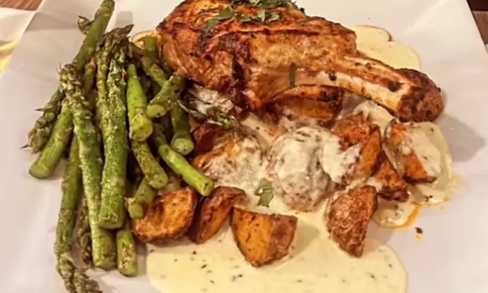 $50 or $100 Toward Food & Drinks or a Meal with Cocktail at Catch 13