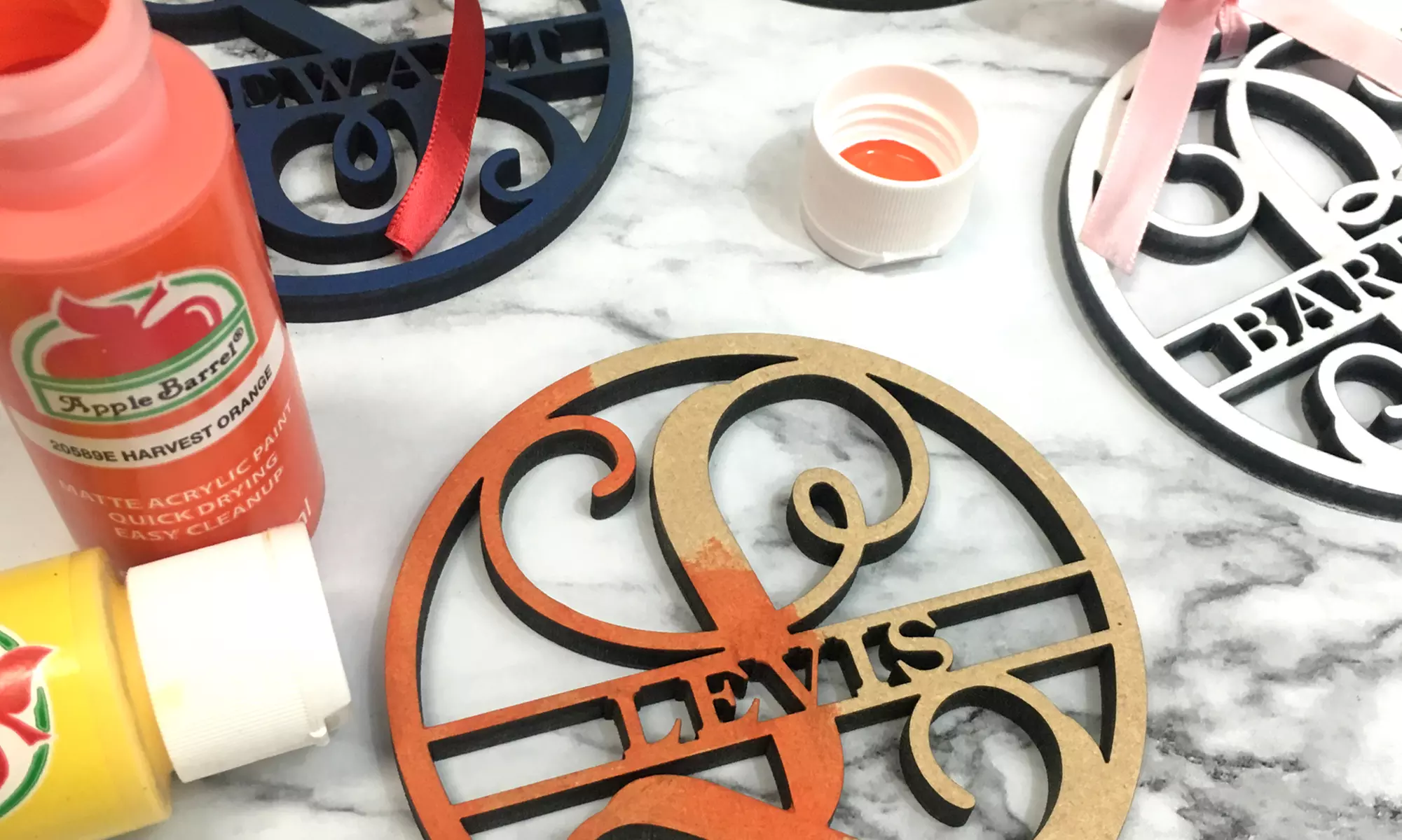 Choice of One, Two, Three, or Four Customized Family Name Wood Ornaments from Metal Unlimited (Up to 60% Off). - Second Medium