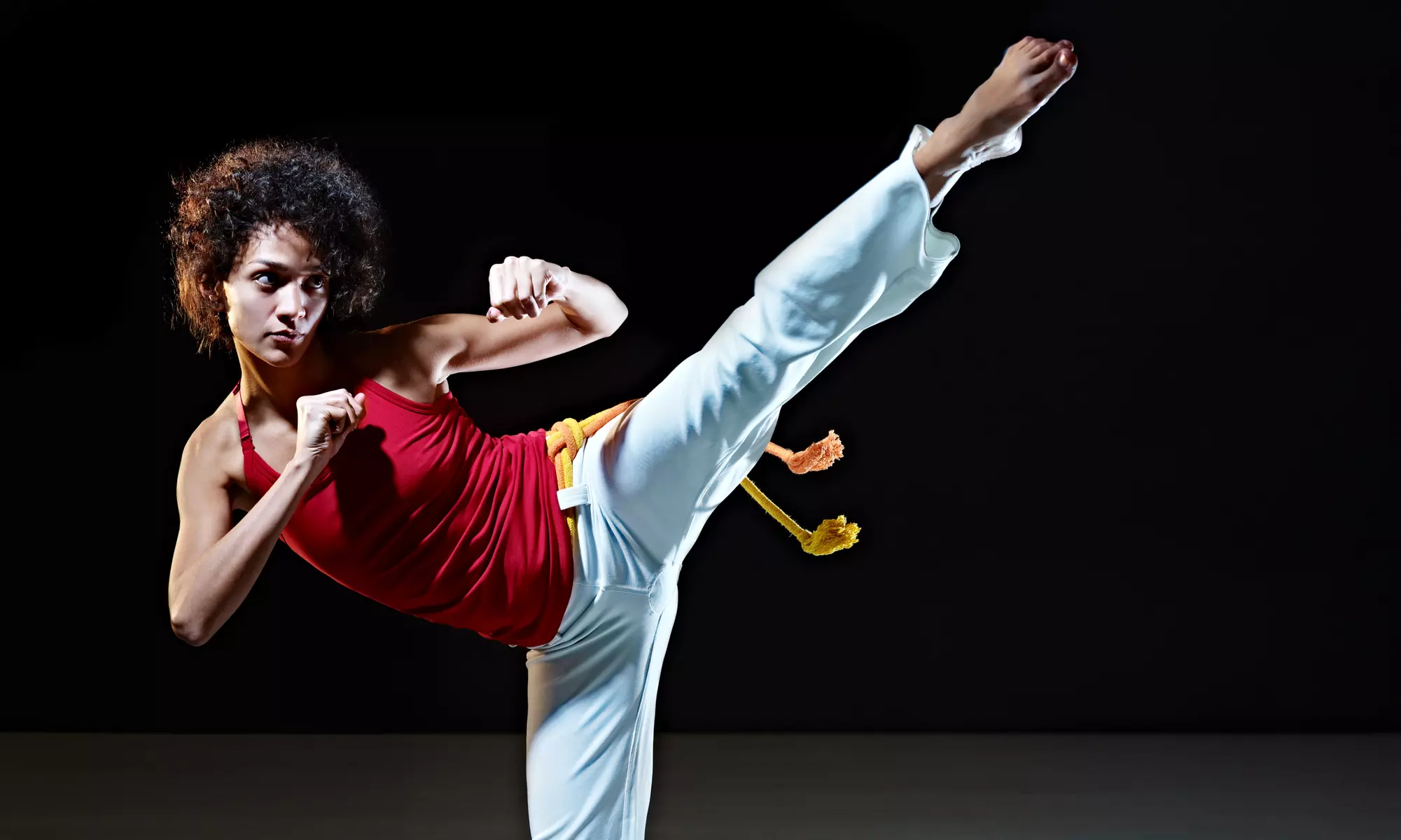 Capoeira Malês invites you to explore classes for kids and adults with up to 50% off, offering a blend of martial arts, music, and dance. - Primary Image