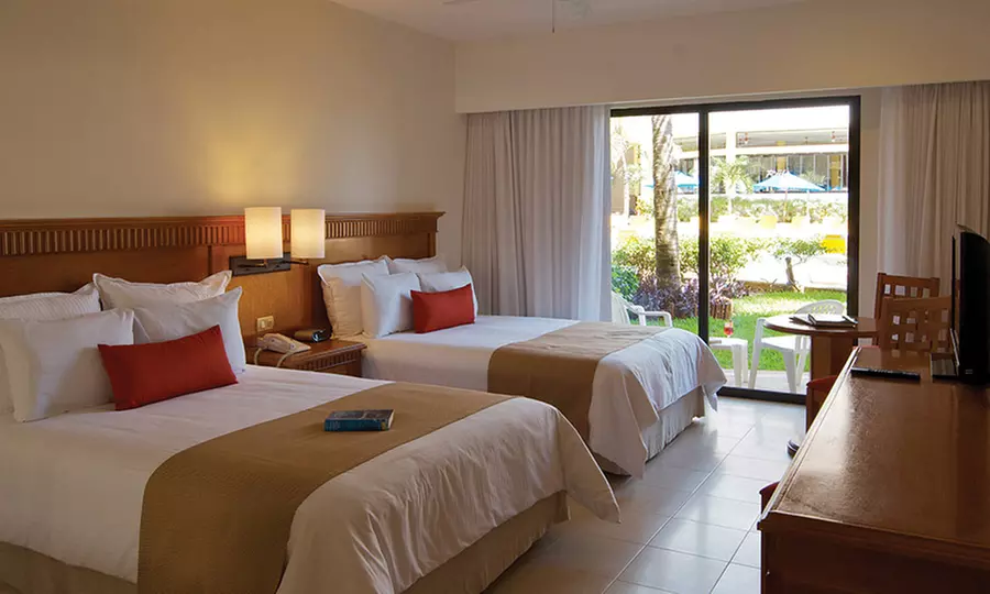 ✈ 4, 6 or 7-Night All-Inclusive The Reef Coco Beach Resort Stay w/ Nonstop Air from Select Cities from Vacation Express - Second Medium