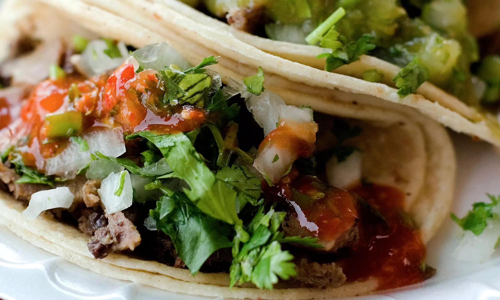 $15 for Three Groupons, Each Good for $10 Worth of Tacos at Taqueria Revolucion ($30 Total Value) - Primary Image