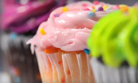 One or Two Dozen Texas-Size Cupcakes or One Dozen Traditional Cupcakes with Free Delivery from EJ's Sweets (Half Off) - Primary Image