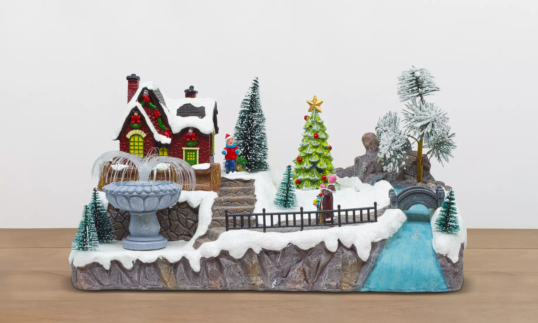 Adorno navideño "Aldea de Navidad" con luces de colores y melodía